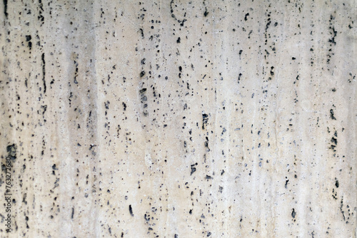 Obraz na płótnie Gray granite wall, with holes, rough rough surface, construction work, interior design, natural stone w salonie
