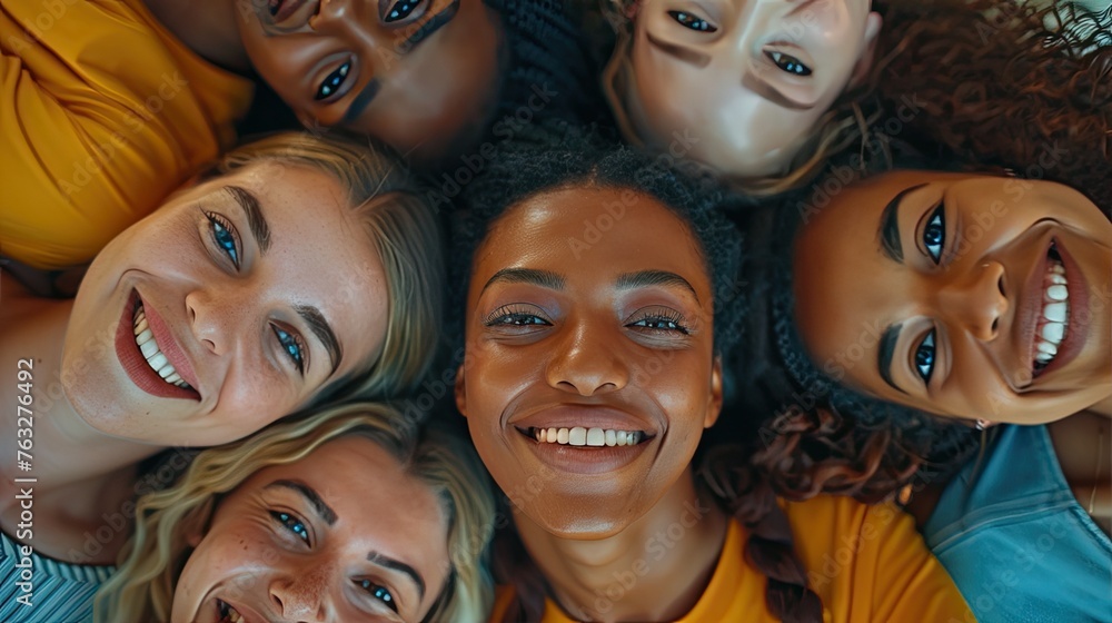 Joyful Diversity: Multi-Cultural, Multi-Generational Smiling Faces Looking Up in High-Angle Indoor Shot Joyful Diversity: Multi-Cultural, Multi-Generational Smiling Faces Looking Up in High-Angle Indoor Shot