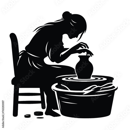Potter Shaping Clay on Pottery Wheel