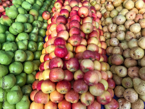 Apples and pears neatly stacked  ready for sale at the bulk market.