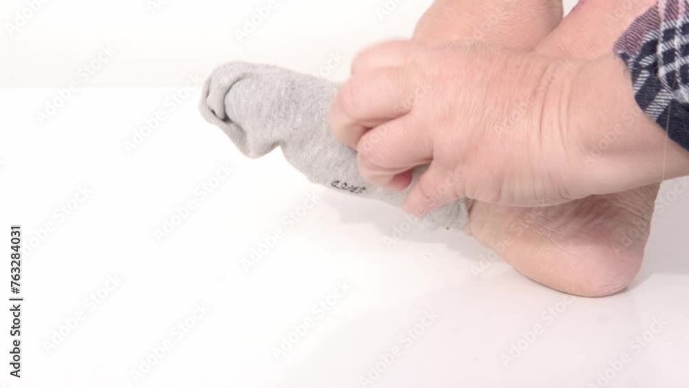 woman taking care of herself, putting on cozy gray cotton sock, Comfort and warmth, Self-care, everyday moments, such getting ready for day woman taking care of herself, putting on cozy gray cotton sock, Comfort and warmth, Self-care, everyday moments, such getting ready for day