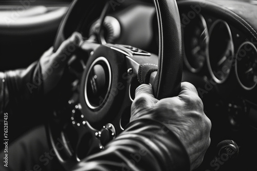 Driver's Hands Gripping a Steering Wheel in a Vehicle Interior © zakiroff