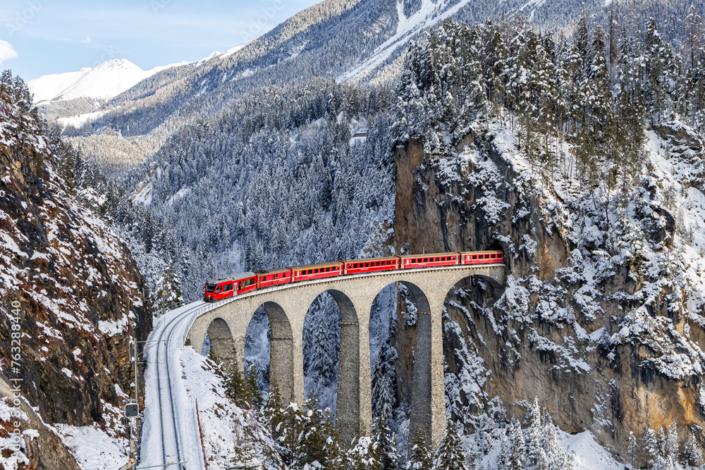 Rhaetian Railway passenger train at the famous Landwasser Viaduct on ...