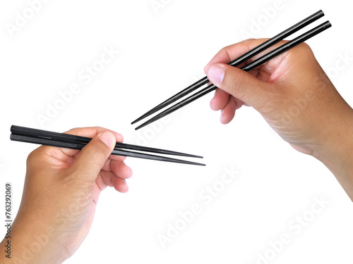 Hand holding wooden chopsticks  transparent background