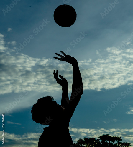  training under bright sunlight, lots of sweat, afternoon sports. Full length of woman standing at beach Young girl playing volleyball on the beach. 