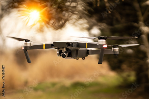 	
Man operating drone/man holding remote control drones/drone controller with sunset background.
