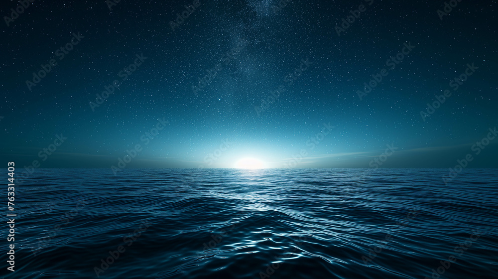 The ocean at night with the sky full of stars.