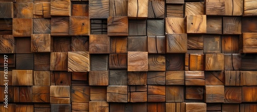 A detailed closeup of a brown hardwood wall made of rectangular wooden cubes. The pattern resembles a brick facade, showcasing the beauty of the building material