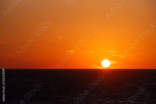 Beautiful sunset sky over the calm ocean.