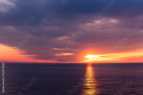 Beautiful sunset sky over the calm ocean. © Mariusz
