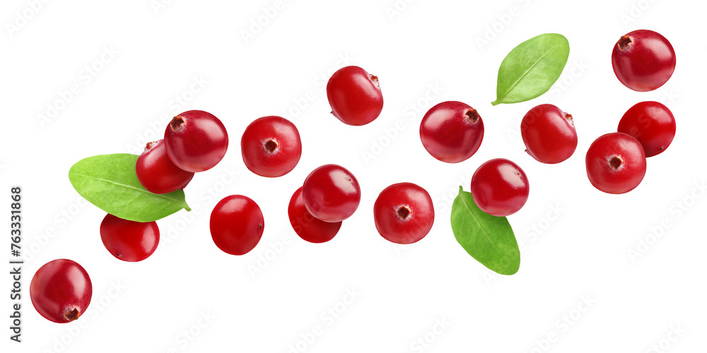Fresh red cranberries and green leaves flying on white background Fresh red cranberries and green leaves flying on white background