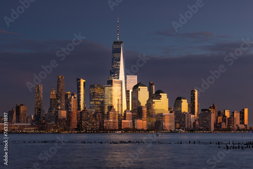 New York City skyline with World Trade Center skyscrapers. Financial District of Lower Manhattan and Hudson River at dusk
