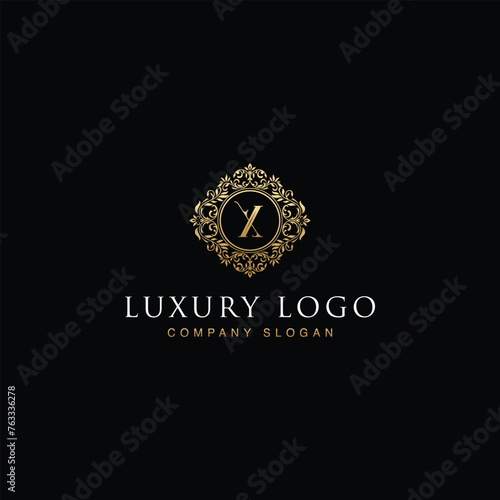 Luxurious elegant victorian floral filigree frame badge pattern with Initial letters X inside  circle badge emblem logo design vector in gold colors