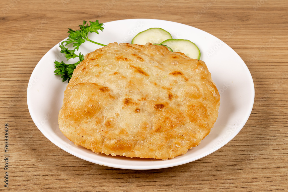 An Indian snack, Puri, a deep fried snack bread, sometimes stuffed as Dhal Puri
