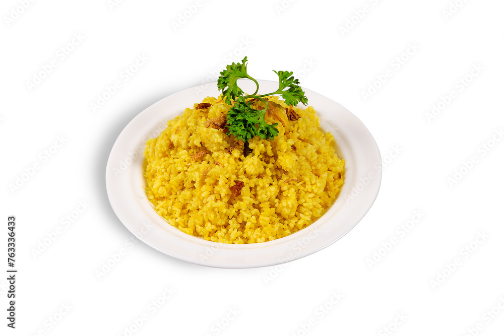 A plate of yellow Khichuri, an Indian dish made with rice and moong lentils A plate of yellow Khichuri, an Indian dish made with rice and moong lentils