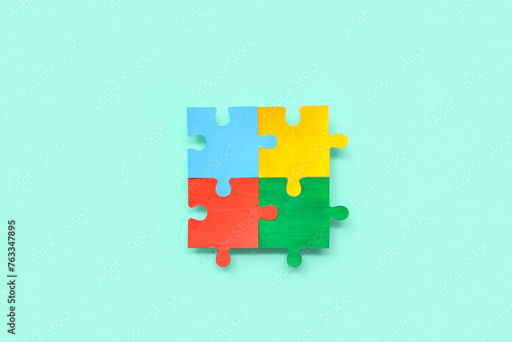 Color puzzle on cyan background. Concept of autistic disorder Color puzzle on cyan background. Concept of autistic disorder