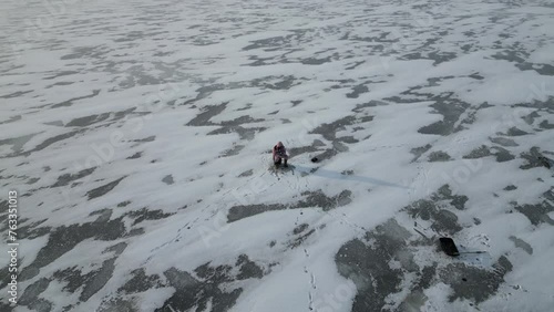 Wallpaper Mural Winter ice fishing. Lonely fisherman catches fish. Torontodigital.ca