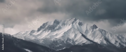 Mountain covered in snow under a cloudy sky © Adi