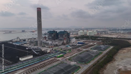 Heavy industrial coal power electricity plant with chimney and pipes, lignite coal product mass ready to be energy for electricity power plant