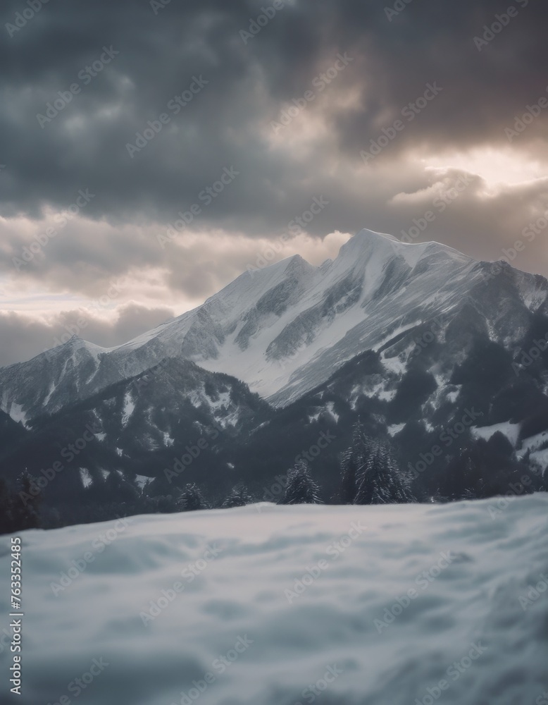 Mountain covered in snow under a cloudy sky