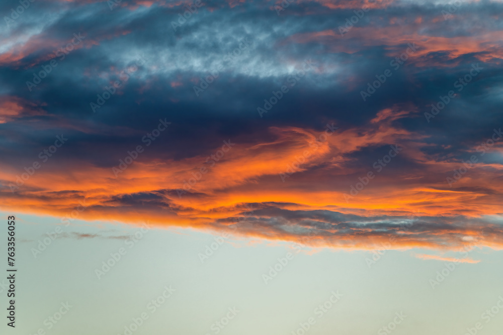 Sunrise or sunset with vivid orange clouds, ideal for warm-toned projects