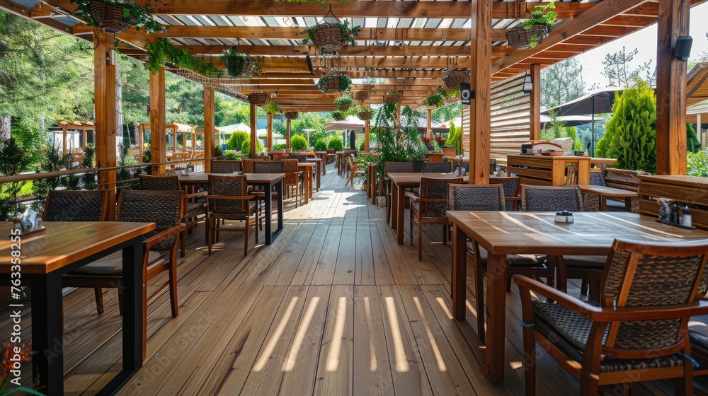 Obraz premium Restaurant covered summer terrace concept with tables, chairs and wooden floor.