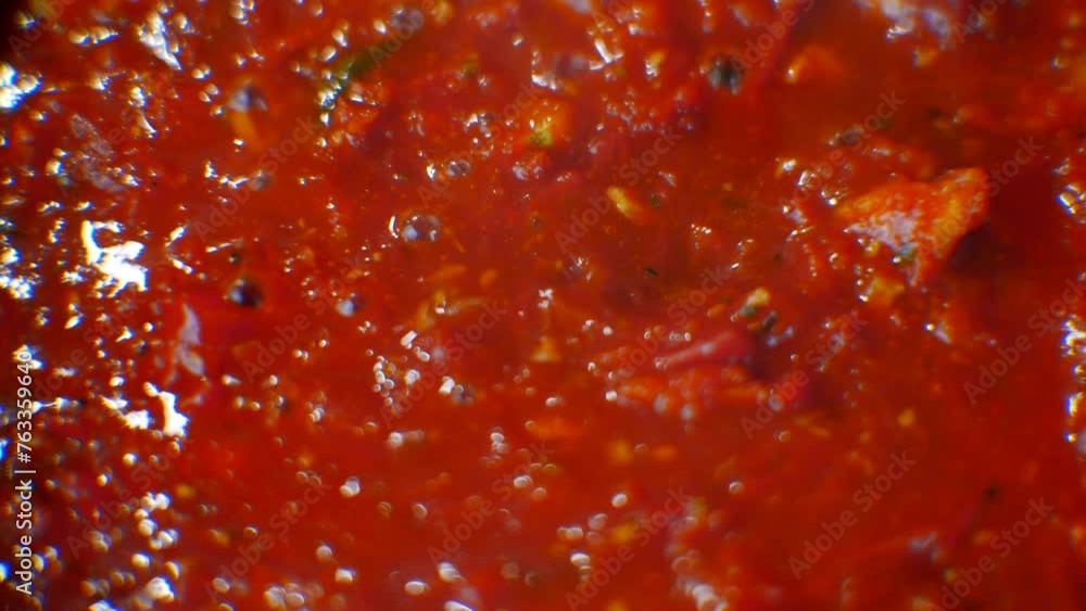 Pasta tomato sauce stirred boiling in pan Pasta tomato sauce stirred boiling in pan