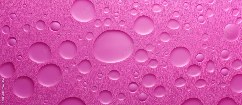 Water droplets on pink surface Water droplets on pink surface