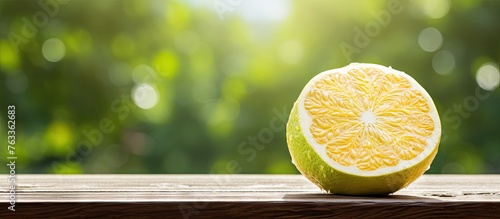 Half lemon on wooden table