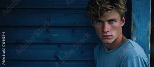 Young man with blue eyes le...