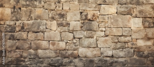 Person passing by a stone wall in close-up view