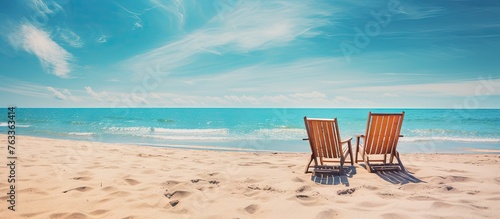 Two chairs overlooking ocea...