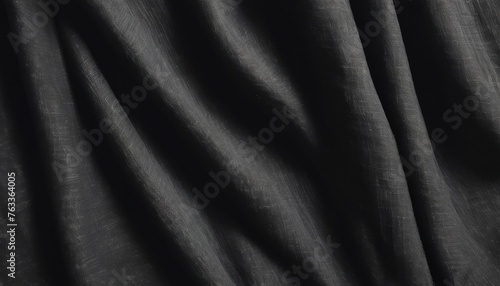 Linen black fabric close-up. Fabric background. Natural materials. Abstract fabric background. Black linen fabric with floral pattern.