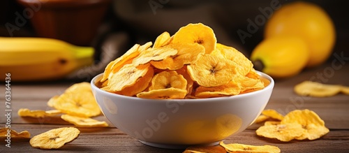 A bowl of banana chips with...