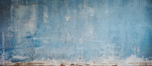 Old wall with peeling blue paint photo