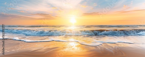 A beautiful sunrise over the ocean, with golden sunlight reflecting on the sand and waves crashing onto it