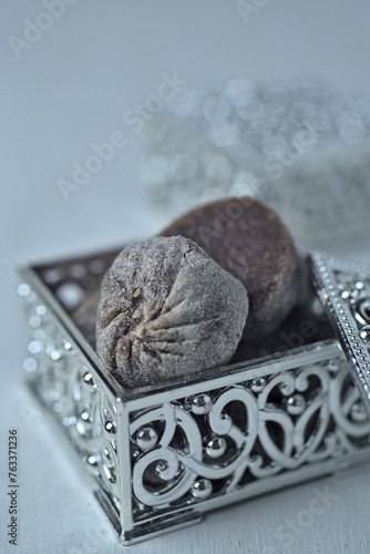 Dodol ladu in silver container. Dodol is a sweet toffee-like sugar palm-based confection originating from the culinary traditions of Indonesia.