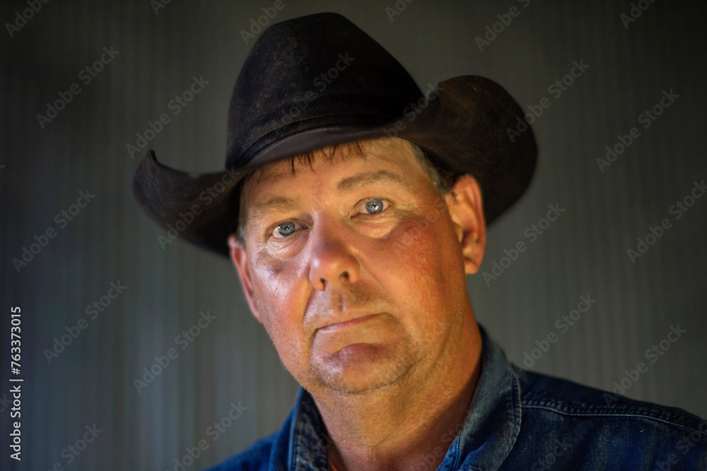 Portrait of a rancher wearing a cowboy hat; Burwell, Nebraska, United States of America Portrait of a rancher wearing a cowboy hat; Burwell, Nebraska, United States of America