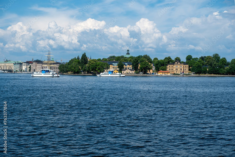 Travel to Sweden, Archipelago Stockholm. Panoramic view of city imposing building. Cruise ship sails