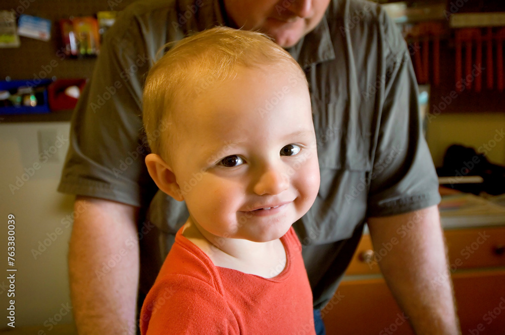 Father with his young son at an outfitters store; Gibbon, Nebraska, United States of America Father with his young son at an outfitters store; Gibbon, Nebraska, United States of America