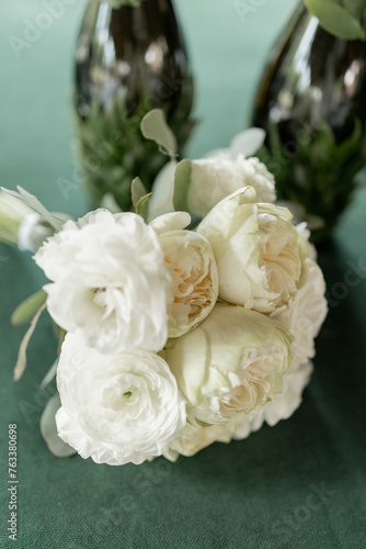 a wedding bouquet of beautiful flowers on the table in the room