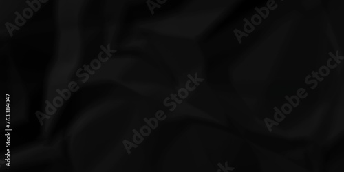 Dark black wrinkly backdrop paper background. panorama grunge wrinkly paper texture background, crumpled pattern texture. black paper crumpled texture. black fabric crushed textured crumpled.