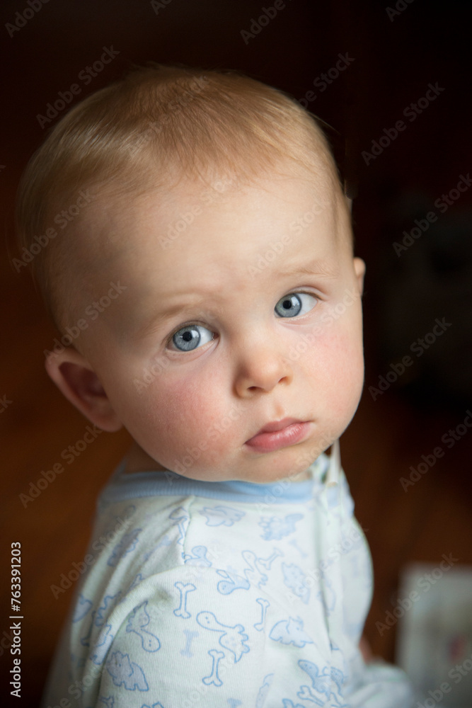 Portrait of a baby boy in a sleeper at home; San Diego, California, United States of America Portrait of a baby boy in a sleeper at home; San Diego, California, United States of America