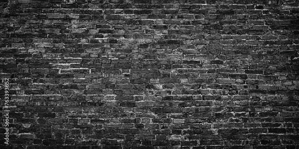 black brick wall for gloomy background design, dark stonework texture