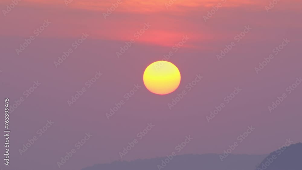 beautiful sunset above the mountain range.The clouds were changing colors as the sun set and the sky was filled with a beautiful orange and purple glow. sweet sky cover the sea background beautiful sunset above the mountain range.The clouds were changing colors as the sun set and the sky was filled with a beautiful orange and purple glow. sweet sky cover the sea background