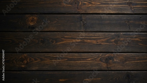 Detailed image showing the texture and pattern of dark stained wooden planks, useful for backgrounds or design elements photo