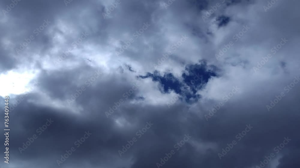Not so formed grayish cumulus clouds moving across the bright sky Not so formed grayish cumulus clouds moving across the bright sky