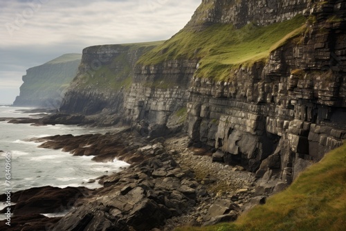 Coastal cliffs meeting the sea in a rugged and breathtaking scene