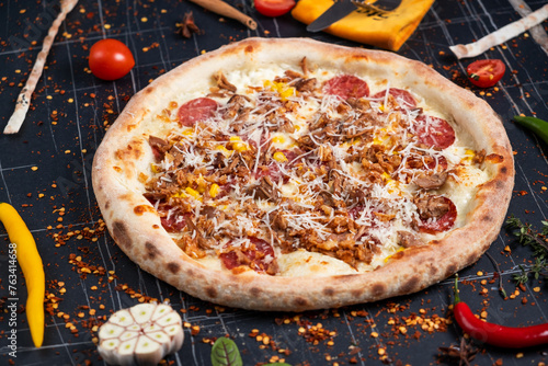 Barbecue pulled pork pizza with cheese, pepper and sauce close-up on the table. horizontal