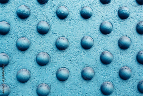 Blue Metal Surface Pattern with Industrial Bolts